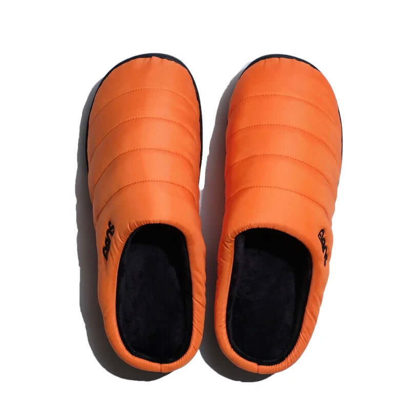 SUBU iconische oranje pantoffels met comfortabele binnenvoering en dikke zool voor koude dagen.