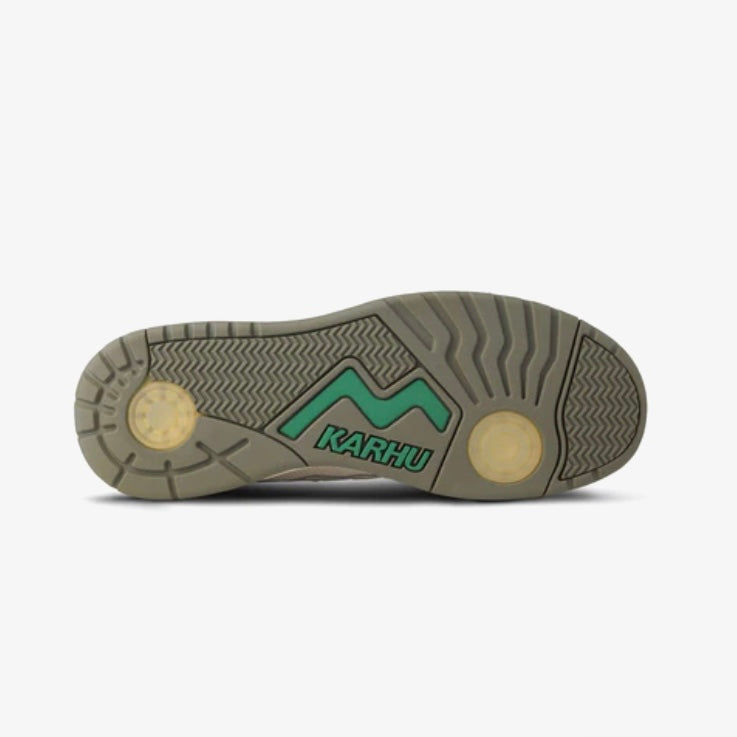 Karhu sneaker outsole featuring retro design elements and a distinctive green logo.